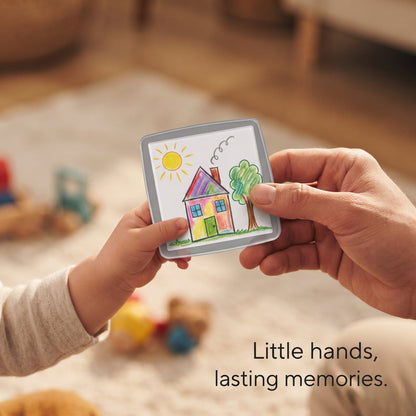 Close-up of child artwork inside a magnetic frame